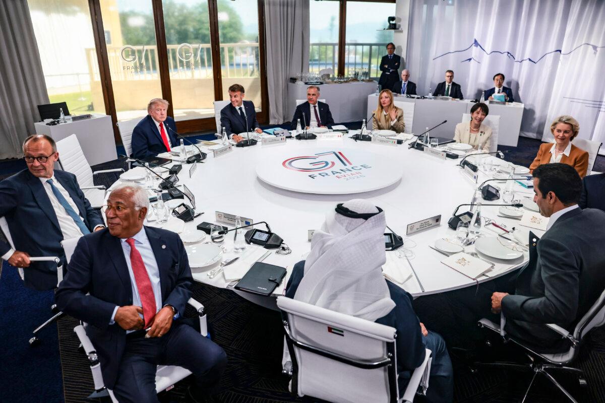 Clockwise from rear left, U.S. President Donald Trump, French President Emmanuel Macron, Canadian Prime Minister Mark Carney, Italian Prime Minister Giorgia Meloni, Japanese Prime Minister Sanae Takaichi, European Commission President Ursula von der Leyen, Qatar Emir Sheikh Tamim bin Hamad Al Thani, Emirati President Sheikh Mohamed bin Zayed Al Nahyan, European Council President Antonio Costa, and German Chancellor Friedrich Merz take part in a working lunch between leaders of G7 and the Middle East, in Evian-les-Bains, France, on June 16, 2026. (Evelyn Hockstein/Pool/Getty Images)