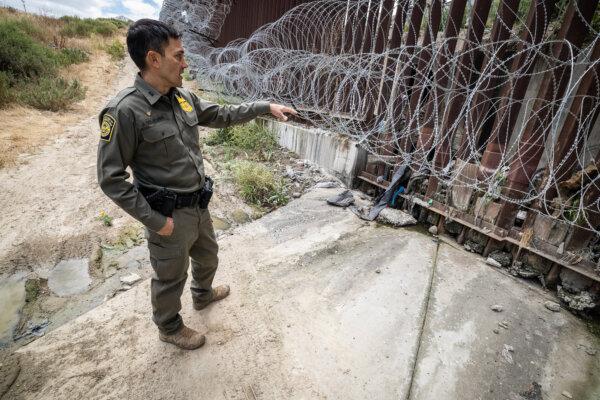 Chief Patrol Agent Justin M. De La Torre of the U.S. Border Patrol’s San Diego Sector checks the southern border wall outside San Diego on May 27, 2026. (John Fredricks/The Epoch Times)