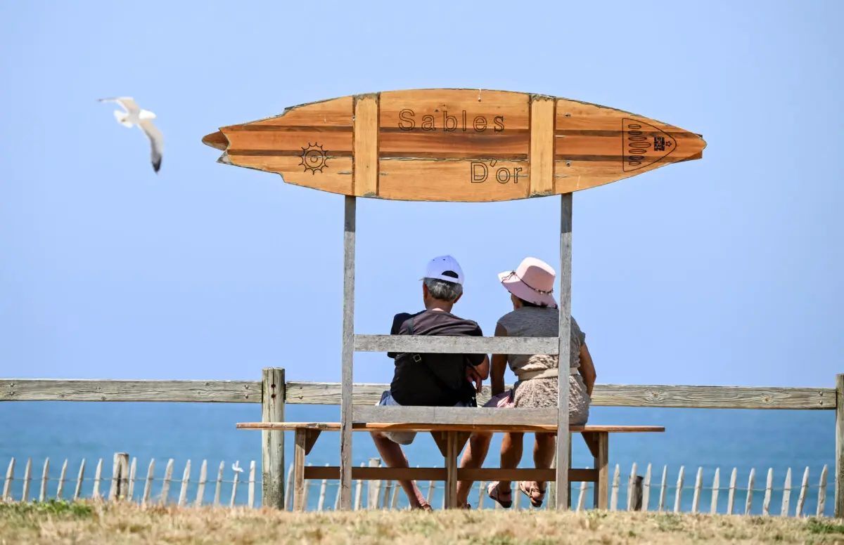 People sunbathe in Anglet as the heatwave sweeps across southwestern France on June 17, 2026. (Gaizka Iroz/AFP via Getty Images)