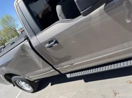Dents are shown in a government-issued vehicle, allegedly caused by an anti-immigration-enforcement activist. (Courtesy of Homeland Security)