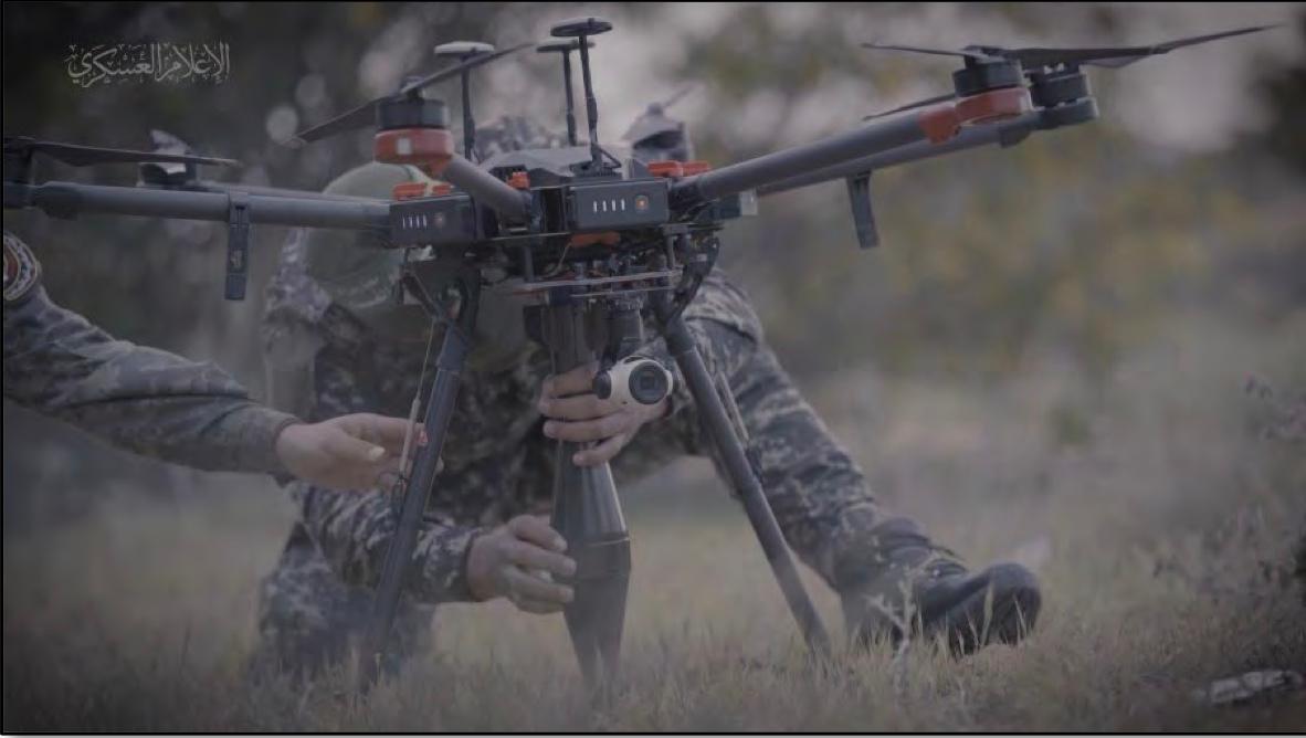 Screenshot showing an al-Qassam Brigades fighter affixing what appears to be an explosive to a drone allegedly found on devices owned by Reda Mazen Rida Sabassi of San Diego, according to the FBI. (U.S. DOJ)