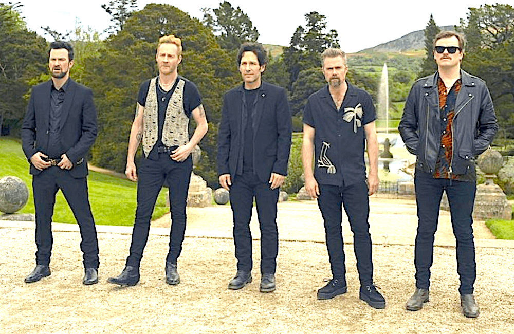 (L–R) Kyle (Keith McErlean), Sandy (Peter McDonald), Rick Power (Paul Rudd), Binzer (Rory Keenan), and Bernie (Paul Reid) are the wedding band "The Bride and the Groove," in "Power Ballad." (David Cleary/Lionsgate)