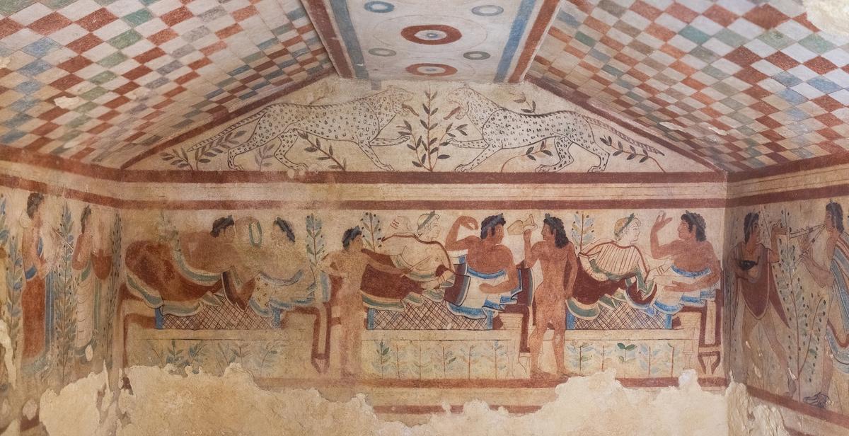 The Tomb of the Leopards, an Etruscan burial chamber located in the Monterozzi Necropolis, features vibrant frescoes from circa 470–450 B.C. that depict leopards above a banqueting scene. (Public Domain)