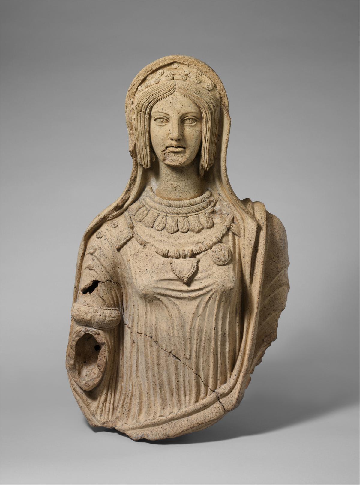 Etruscan statue of a young woman, late 4th–early 3rd century B.C. Terracotta; 29 7/16 inches. When complete, the statue probably stood in a sanctuary and showed the young woman holding an incense box in her extended right hand. Metropolitan Museum of Art, New York City. (Public Domain)