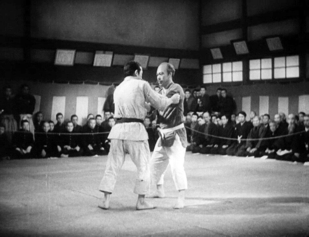 Sanshiro Sugata (Susumu Fujita, L) engages in combat with Hansuke Murai (Takashi Shimura), in “Sanshiro Sugata.” (Toho)