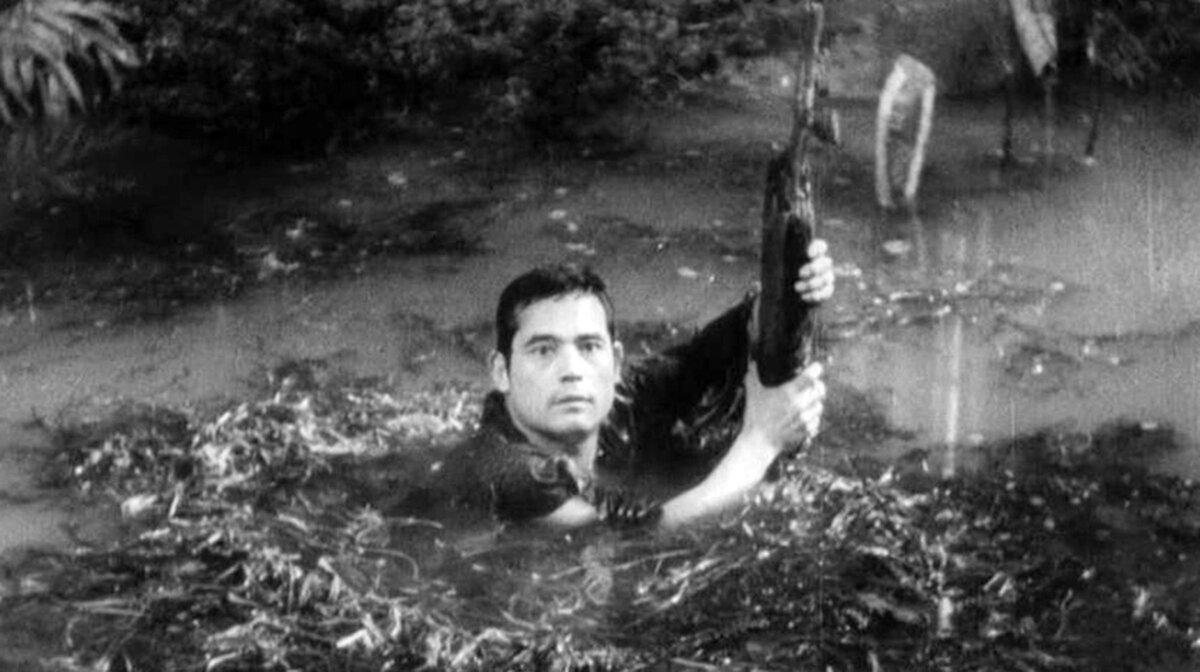 Sanshiro Sugata (Susumu Fujita) in a rather cold bog, in “Sanshiro Sugata.” (Toho)