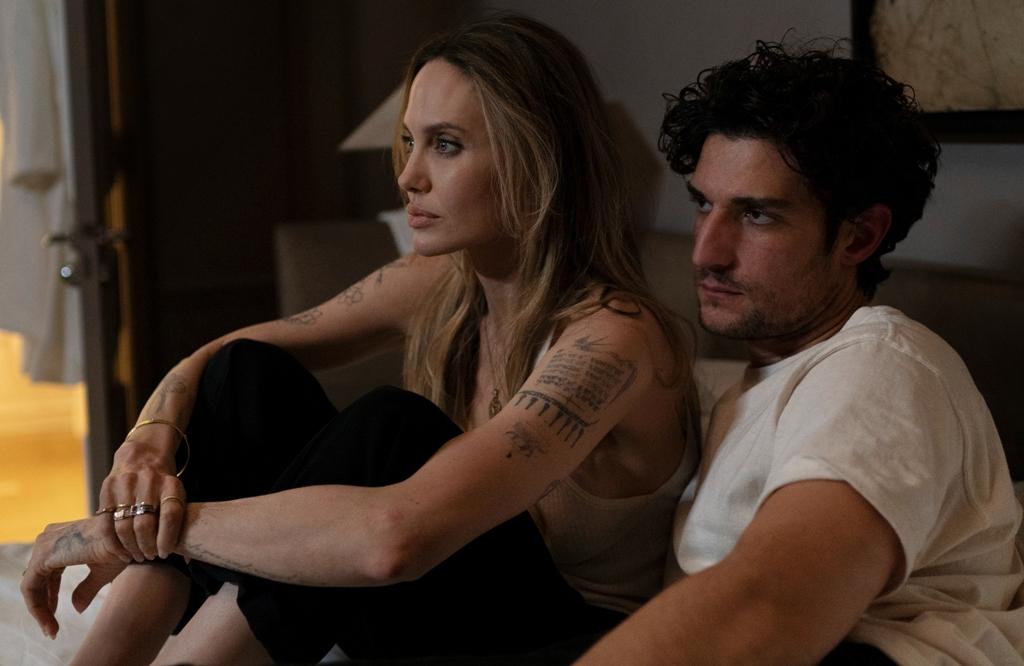 Maxine Walker (Angelina Jolie) and her assistant Anton (Louis Garrell), "Couture." (Vertical)