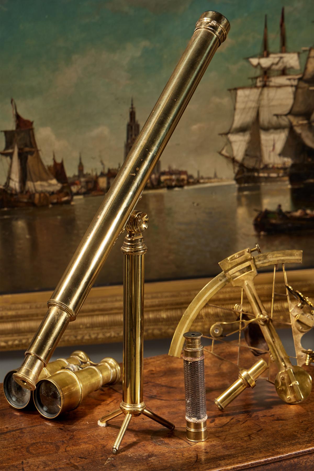 Maritime objects from the collection of Maurice Tempelsman, including a group of brass optical instruments and an English brass radius vernier sextant. (Sotheby's)