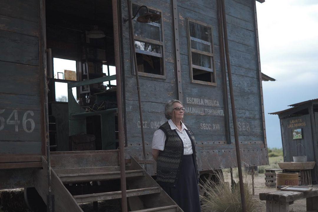 Miss Georgina (Adriana Barraza) waits for her students, in “Where the Tracks End.” (Netflix)