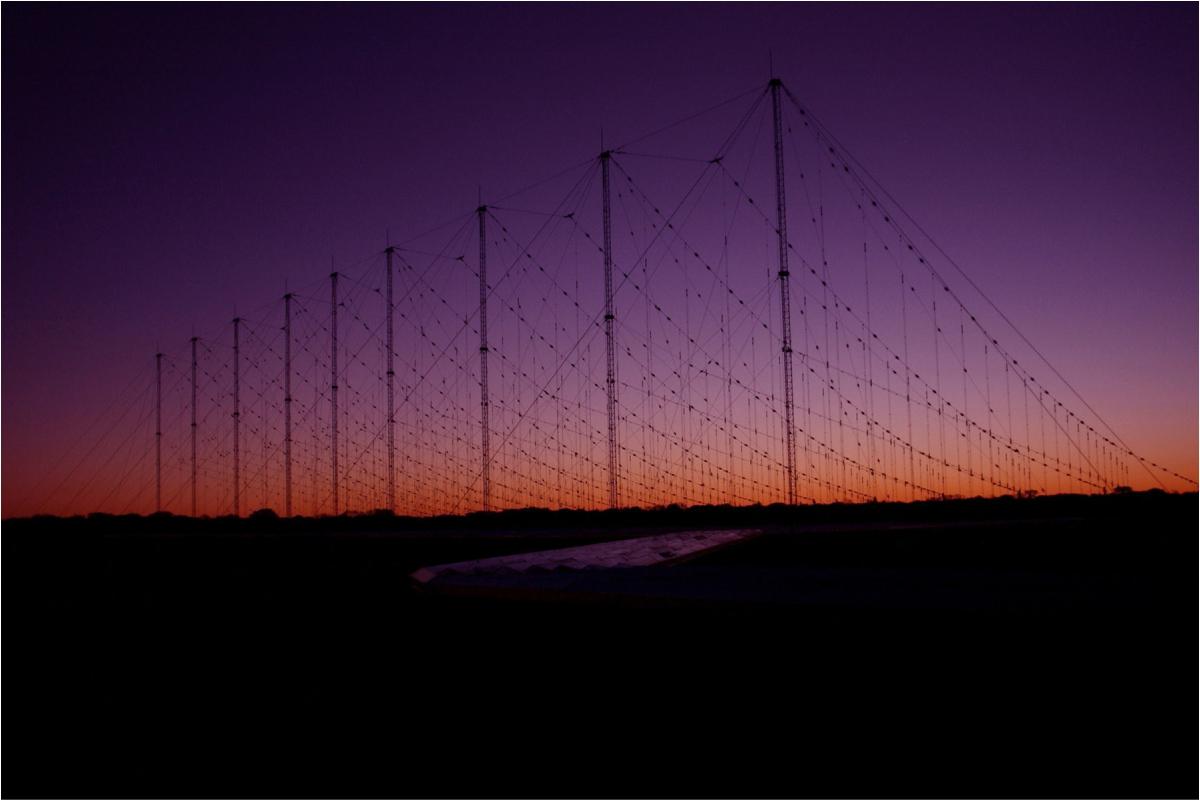A Jindalee Operational Radar Network(JORN) transmitter site at sunset, Harts Range, Alice Springs. The Jindalee Operational Radar Network (JORN) is a strategic asset used in the Defence of Australia. JORN is a network of three over-the-horizon radars that can detect aircraft and ships between 1000 and 3000km from the northern coastline of mainland Australia. (Courtesy of the LACW Sonja Canty at the Australian Department of Defence)