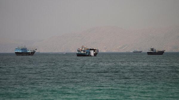 Vessels at the Strait of Hormuz, as seen from Musandam, Oman, on June 22, 2026. (STR/Reuters)