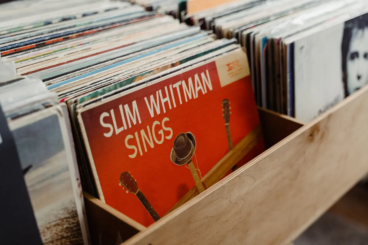 Large-format album artwork offers a visual context that digital music minimizes. Album jackets also include lyrics and production credits that deepen the listening experience. (Tima Miroshnichenko/Pexels)