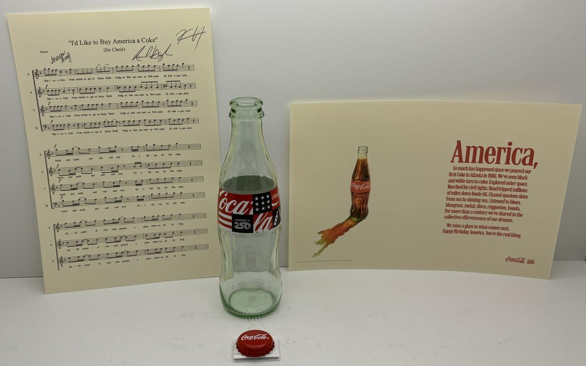 Also included in the time capsule: As part of America250’s America’s Soundtrack initiative, Coca-Cola donated a “message in a bottle” with a lyrics sheet for their song, “I’d Like to Buy the World a Coke” inside an iconic Coke bottle. (Courtesy of America250)