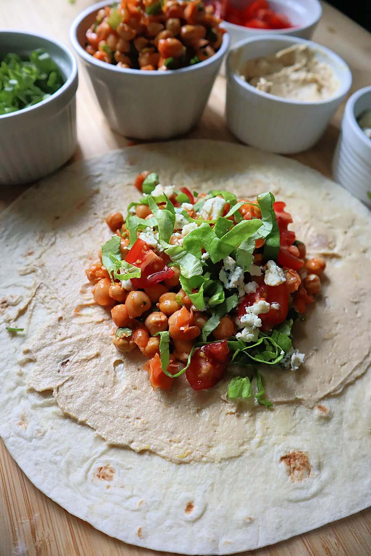 The filling for a Buffalo chickpea wrap includes lettuce, tomato, and blue cheese. (Gretchen McKay/Pittsburgh Post-Gazette/TNS)