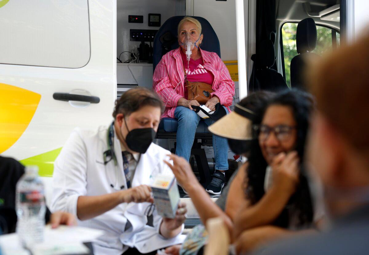A resident receives oxygen therapy during a health services pop-up at Our Lady of Victory Catholic Church in Los Angeles on June 23, 2026. (Justin Sullivan/Getty Images)