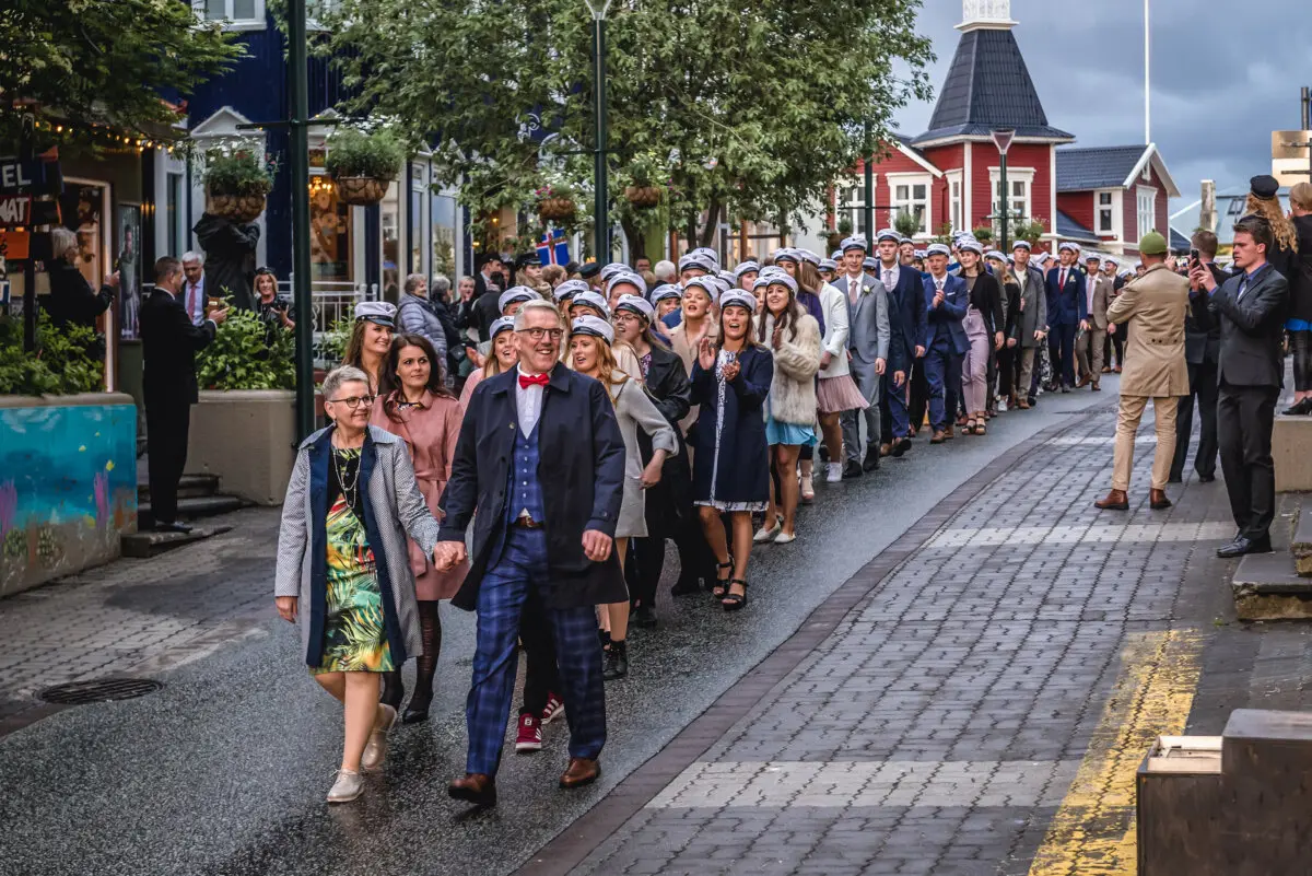 Junior college graduates march during the celebration of Iceland's National Day in Akureyri, Iceland. (Shutterstock/Fotokon)