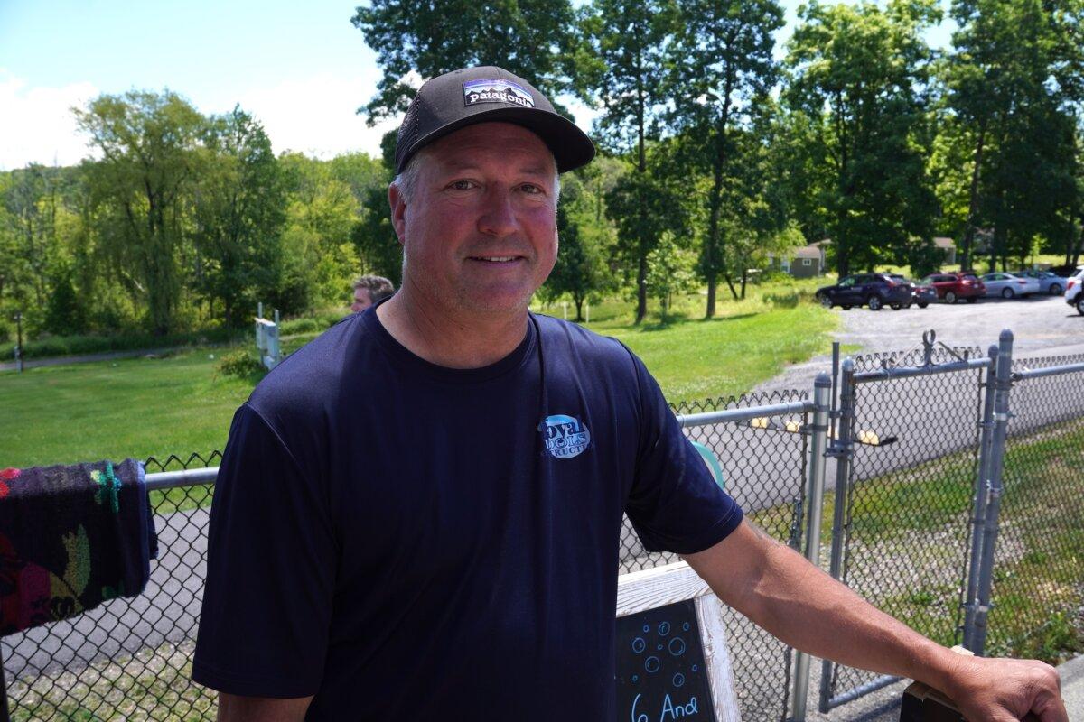 Third-generation Royal Pools Construction owner Greg DePuy at the newly renovated Mountain Lake Park Pool in Warwick, N.Y., on June 24, 2026. (Oliver Mantyk/The Epoch Times)