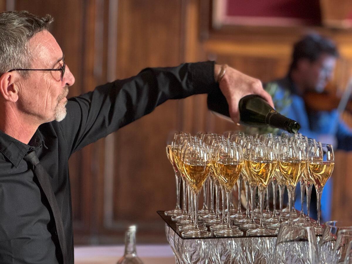 Champagne gets poured during a pre-dinner concert at a castle in Uzes. (Lori Rackl/TNS)