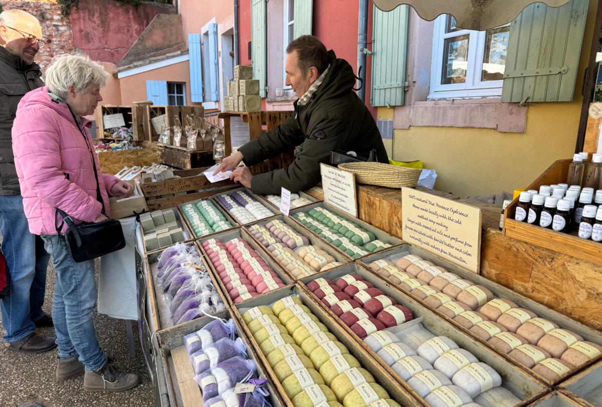 A market vendor in the colorful village of Roussillon, one of the non-river towns cruise passengers can visit by bus. (Lori Rackl/TNS)
