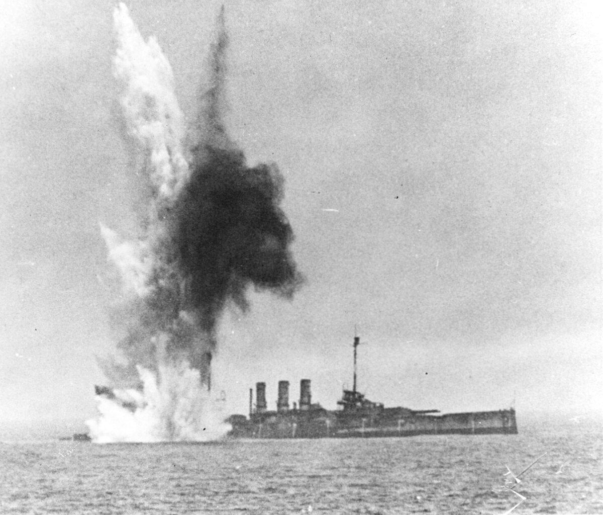 A 2,000-pound bomb "near-miss" severely damages the Ostfriesland at the stern hull plates. (Public Domain)