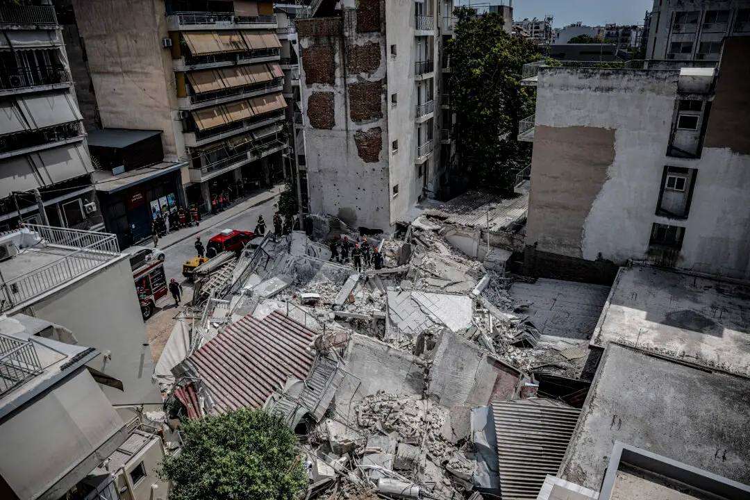 Day in Photos: Building Collapse in Greece, Flooding in Nigeria, and Royal Navy Exercises