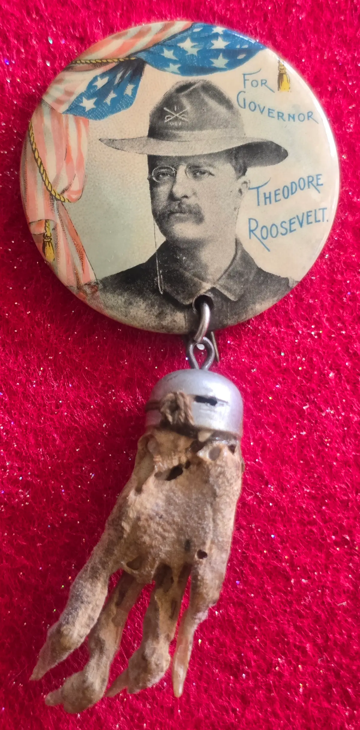 A lucky rabbit's foot is attached to a Teddy Roosevelt button. (Tom and Becky Peeling)