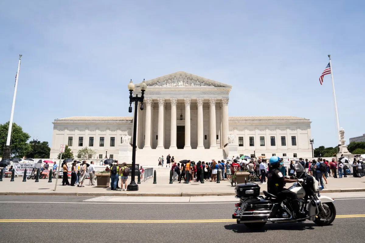 People outside the Supreme Court in Washington on June 30, 2026. (Madalina Kilroy/The Epoch Times)