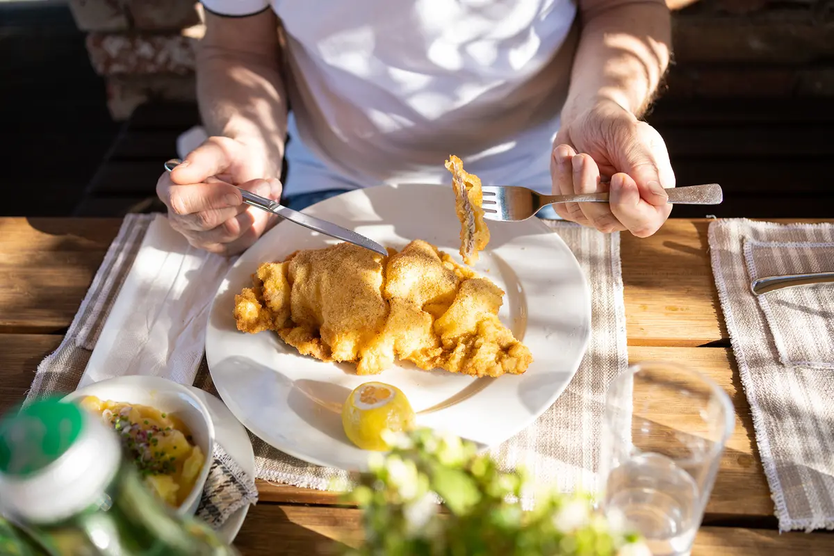 Wiener schnitzel traditionally consists of a thin breaded veal cutlet fried until crisp and served alongside parsley potatoes or potato salad. (ingwervanille/Getty Images)