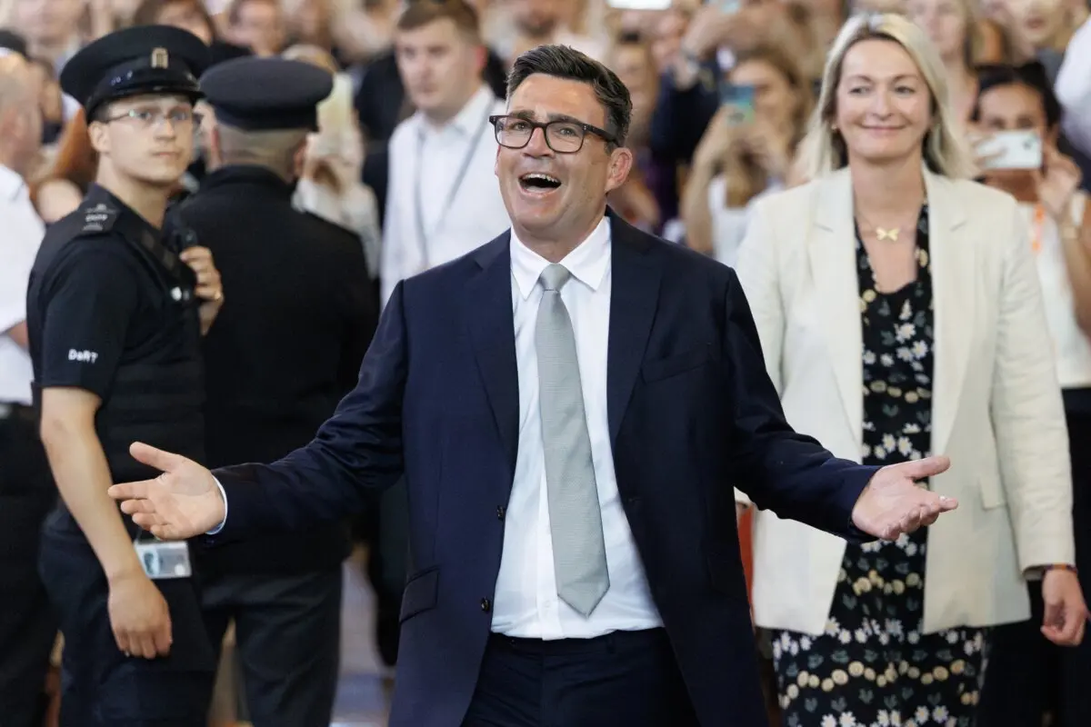 Andy Burnham, Labour MP for Makerfield, celebrates after his swearing-in at the Houses of Parliament in London on June 22, 2026. (Dan Kitwood/Getty Images)