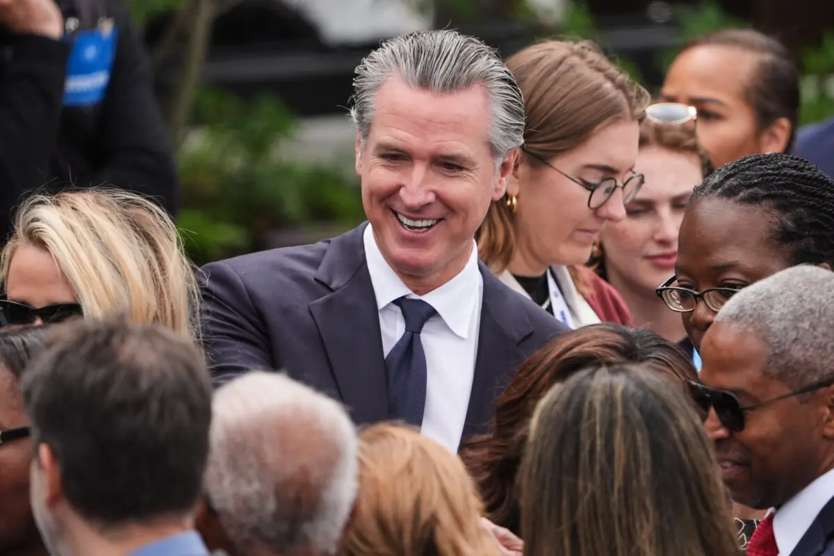 California Gov. Gavin Newsom mingles ahead of the Obama Presidential Center dedication ceremony in Chicago on June 18, 2026. (AP Photo/Jeff Roberson)