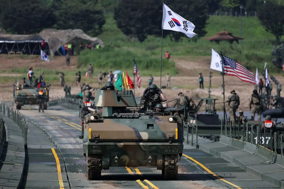 U.S. soldiers from the 2nd Infantry Division and South Korean soldiers participate in a river crossing exercise as part of the Ulchi Freedom Shield exercise in Yeoju-gun, South Korea, on August 27, 2025. (Chung Sung-Jun/Getty Images)