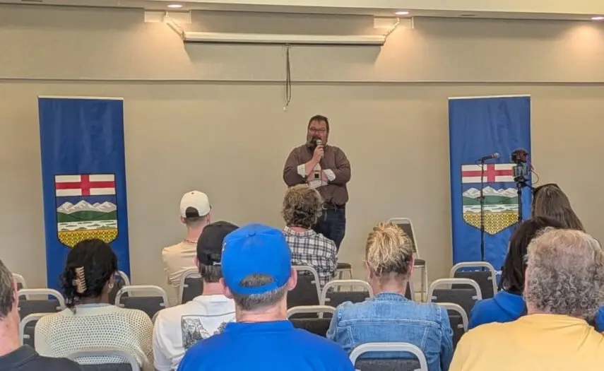 Author Benoit Trudeau speaks to the audience at a "Let's Talk Alberta" event in Calgary on June 23, 2026. (Paul Rowan Brian/The Epoch Times)