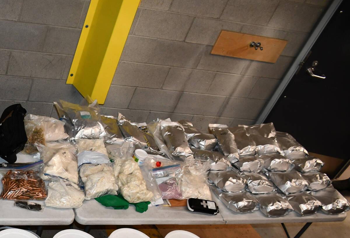 The Burnaby RCMP Gang Enforcement Team confiscated thousands of kilograms of illegal precursor chemicals, in addition to cash and firearms. (RCMP handout photo)