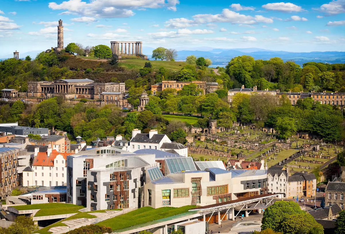 The view of the Parliament and the Calton Hill is a kaleidoscope of centuries and architectural styles. (ewg3D/Getty Images)