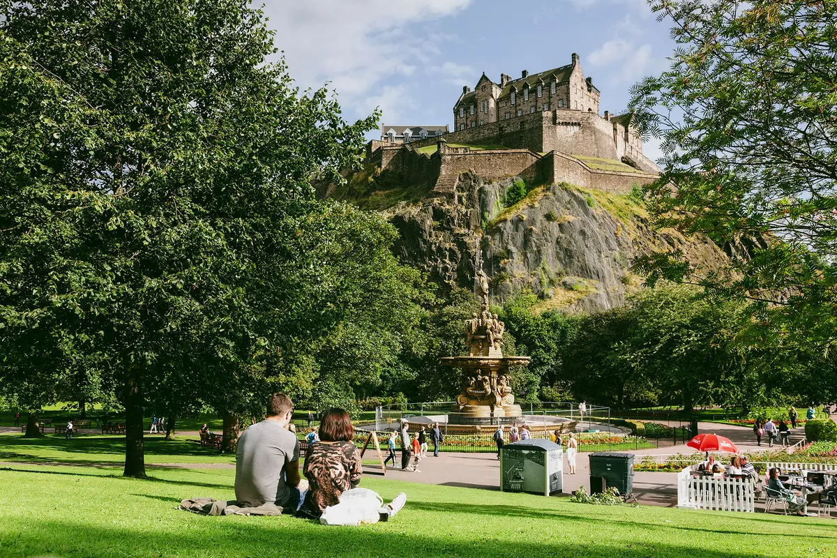 A picnic around the Ross Fountain is just the thing for a summer afternoon at the Princes Street Gardens. (Sylvain Sonnet/Getty Images)