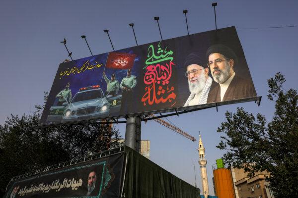 A billboard depicting Iran's late Supreme Leader Ayatollah Ali Khamenei and his son, Ayatollah Mojtaba Khamenei, at Valiasr Square in Tehran, Iran, on July 2, 2026. (Murad Sezer/Reuters)