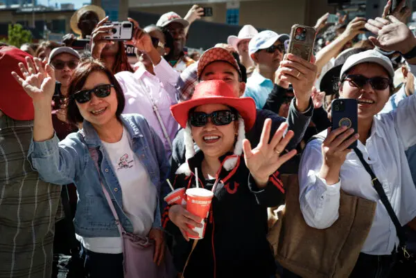 Crowds wave during the Calgary Stampede parade in Calgary on July 3, 2026. (The Canadian Press/Jeff McIntosh)