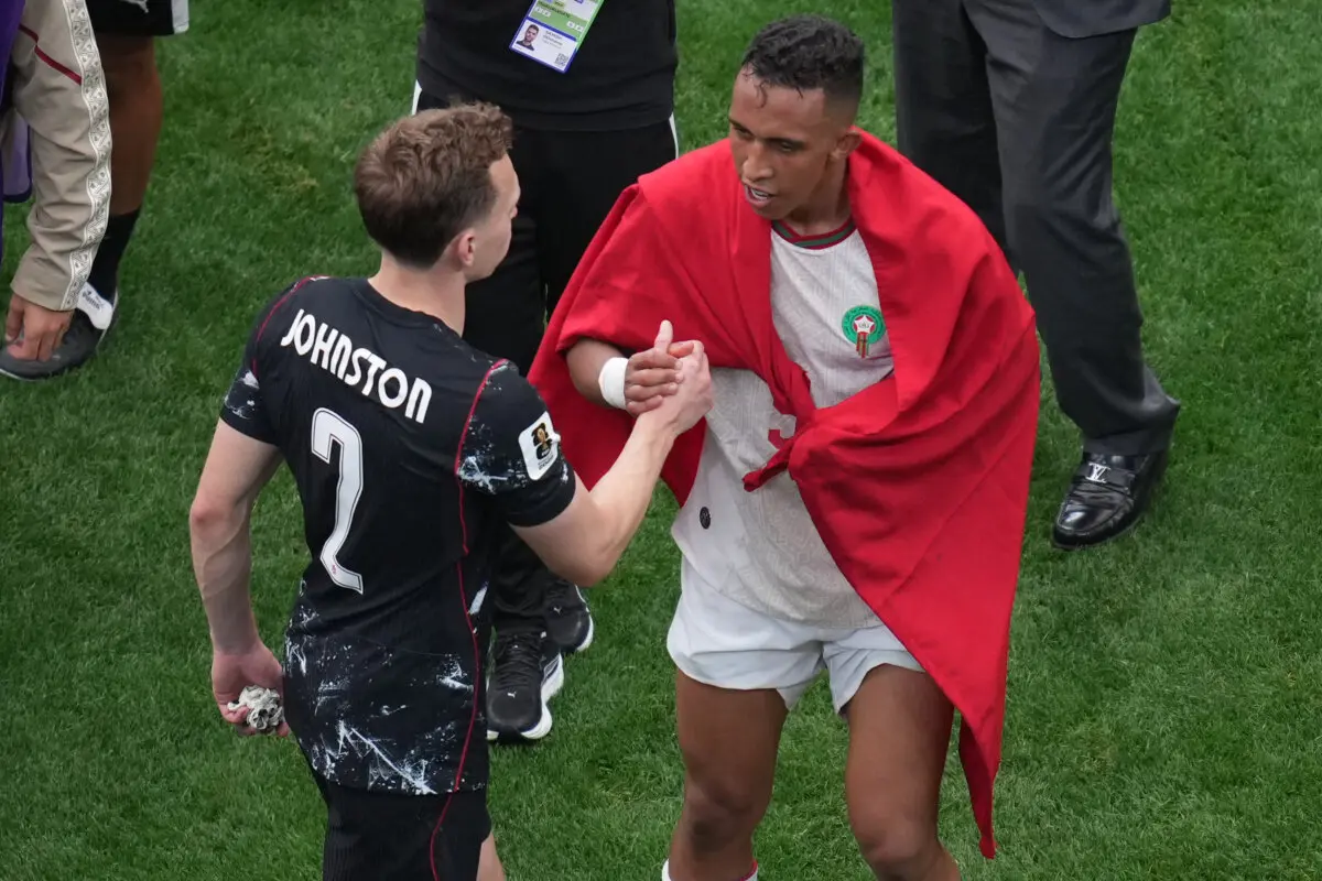 Canada's Alistair Johnston (L) congratulates Morocco's Soufiane Rahimi after the World Cup round of 16 soccer match between Canada and Morocco in Houston on July 4, 2026. (Eric Smith/AP Photo)