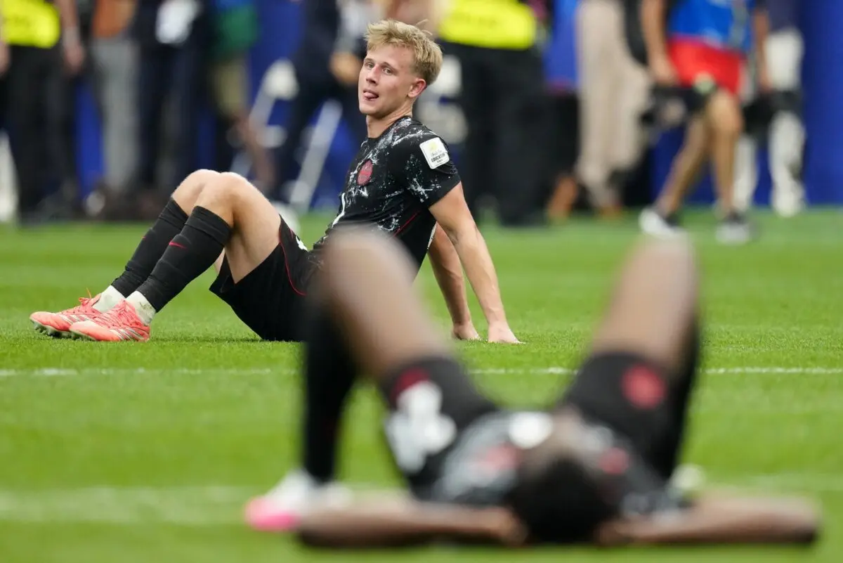 Canada's Luc de Fougerolles sits on the turf following the team's loss to Morocco in FIFA World Cup round of 16 soccer action, in Houston on July 4, 2026. (The Canadian Press/Frank Gunn)