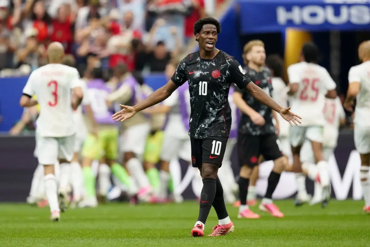 Canada's Jonathan David reacts as Morocco players celebrate their second goal during second half FIFA World Cup round of 16 soccer action, in Houston on July 4, 2026. (The Canadian Press/Frank Gunn)