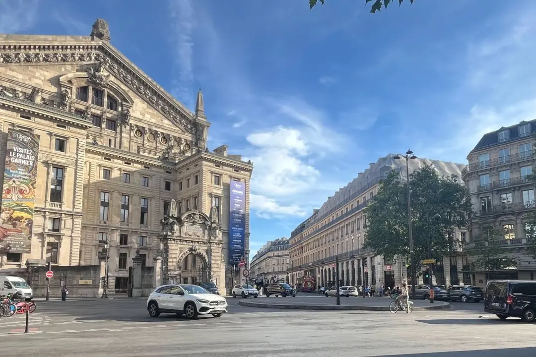 The rear of the Opéra Garnier in Paris, framed by buildings reflecting the iconic Haussmann architectural style of the 19th century, on July 5, 2026. (Etienne Fauchaire/The Epoch Times)