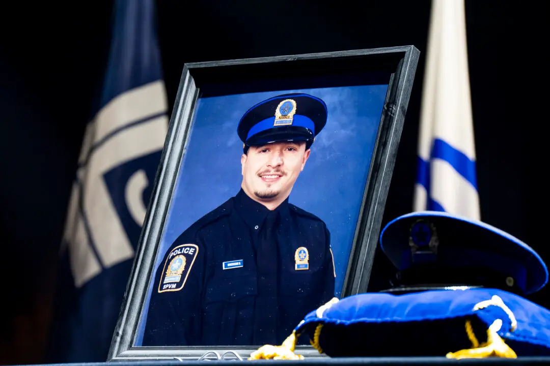 Police Officers March in Montreal Ahead of Funeral for Officer Killed in Shooting