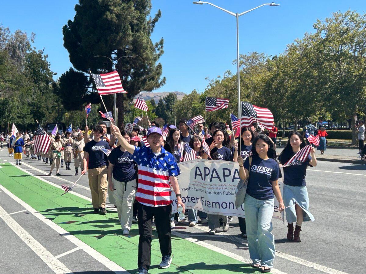 Members of Asian Pacific American Public Affairs participate in a parade in Fremont, Calif., on July 4, 2026, celebrating the 250th anniversary of the founding of the United States. (Nathan Su/The Epoch Times)