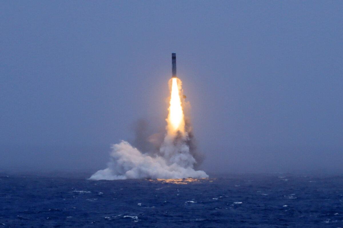 In this photo released by China's state media Xinhua, a long-range ballistic missile bursts out of the sea during a test launch from a Chinese nuclear-powered submarine in the South Pacific on July 6, 2026. (Li Xiangchao/Xinhua via AP)