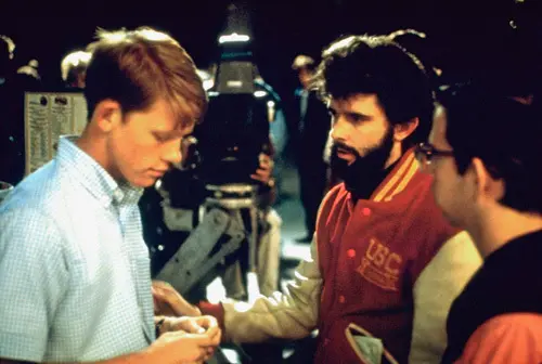 (L–R) Ron Howard, George Lucas, and Charles Martin Smith on the set of “American Graffiti.” (Universal Pictures)