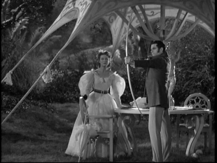 Elizabeth Bennet (Greer Garson) learns archery from Mr. Darcy (Lawrence Olivier), in “Pride and Prejudice.” (MGM)