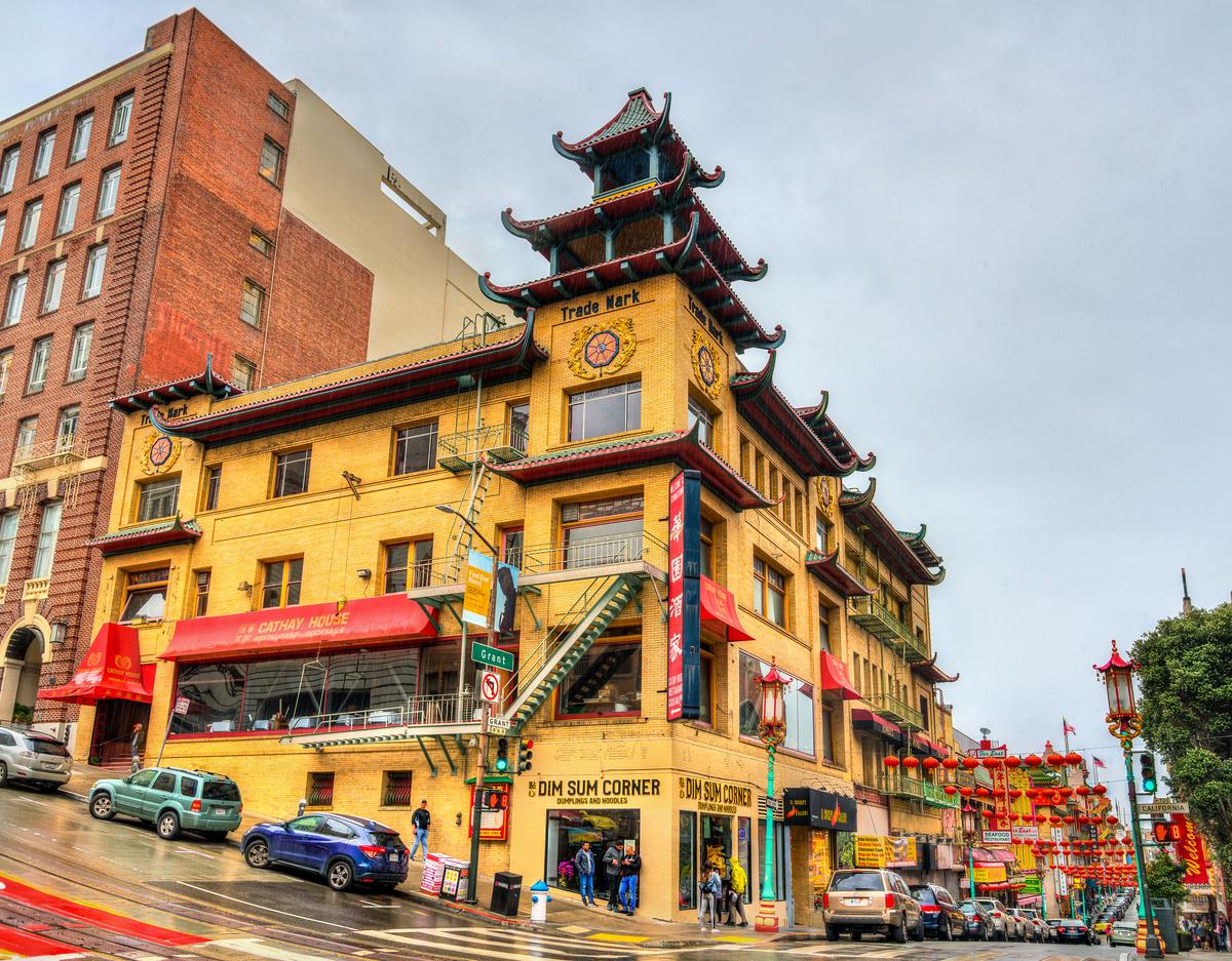 The Sing Chong Building is a richly detailed structure featuring Chinese-inspired architectural elements such as flared roof eaves, upturned corners, and a green, multi-tiered pagoda-style roof that set the aesthetic for the Chinatown's reconstruction. (Leonid Andronov/Shutterstock)