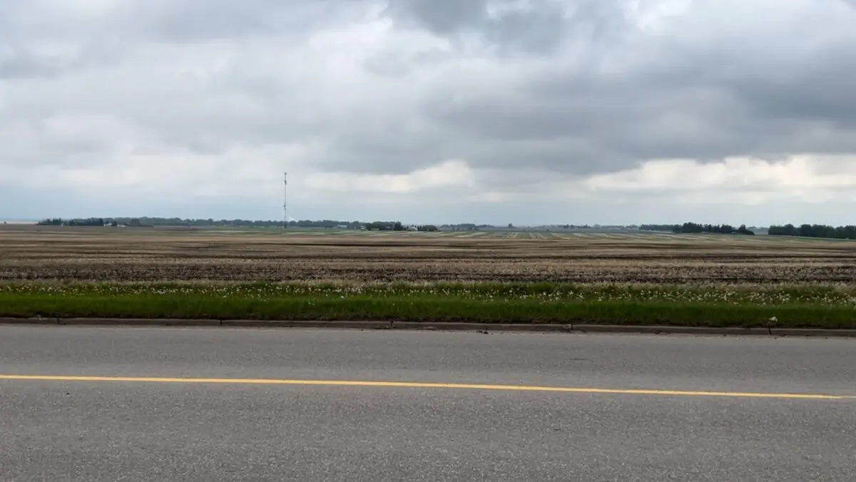 The property where Synapse Real Estate Corp. is planning a data centre complex with 1.4 gigawatts of natural gas-fired power generation is seen from across Highway 2A , in Olds, Alta., on June 4, 2026. (The Canadian Press/Lauren Krugel)