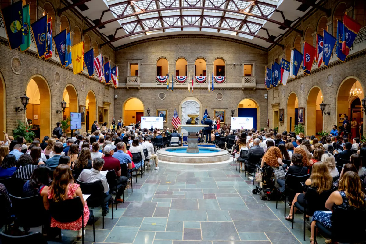 The U.S. Department of Agriculture’s Whitten Patio Atrium is filled with young winners of the American Heroes Student Art Contest and their families. (Chris Tilley Photography)