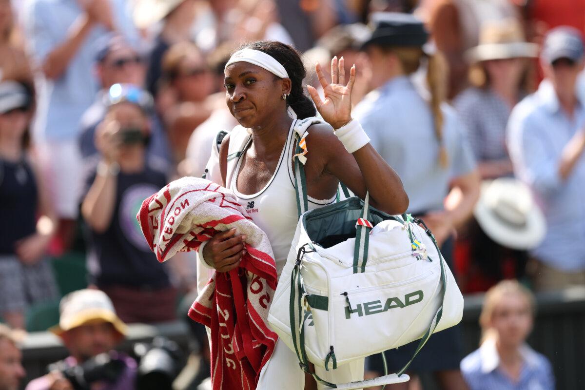 Coco Gauff of the United States acknowledges the crowd as she leaves the court following defeat to Karolina Muchova of Czechia during their Ladies' Singles semifinal match on day eleven of The Championships Wimbledon 2026 at All England Lawn Tennis and Croquet Club in London on July 9, 2026. (Clive Brunskill/Getty Images)